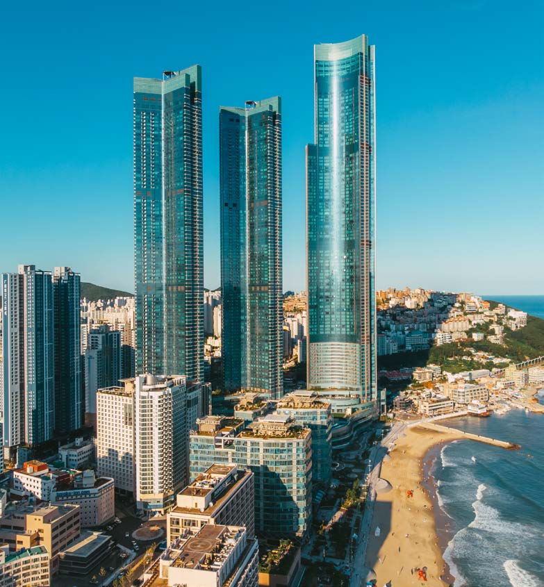 LCT Sharp Landmark Tower — three glass skyscrapers beside Haeundae Beach, Busan