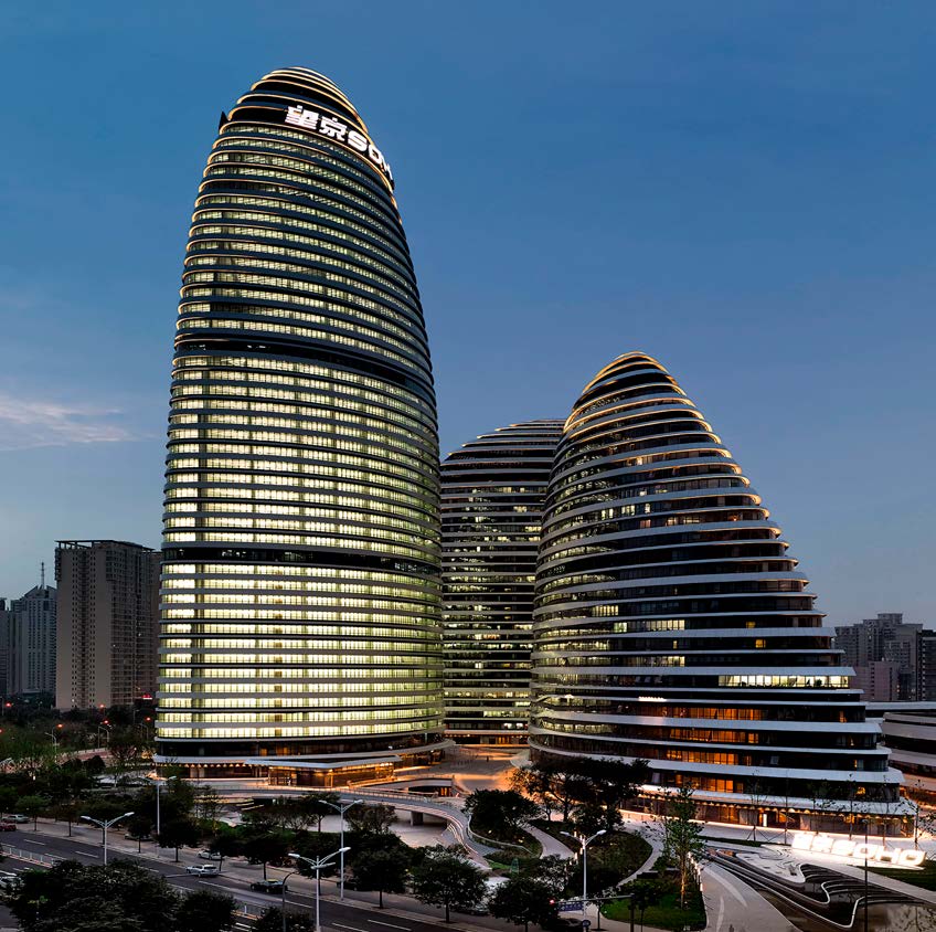 Wangjing Soho — three curvilinear office towers at dusk in Beijing's Wangjing district